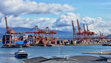 Shipping containers are off-loaded from a ship at a terminal at the Port of Vancouver