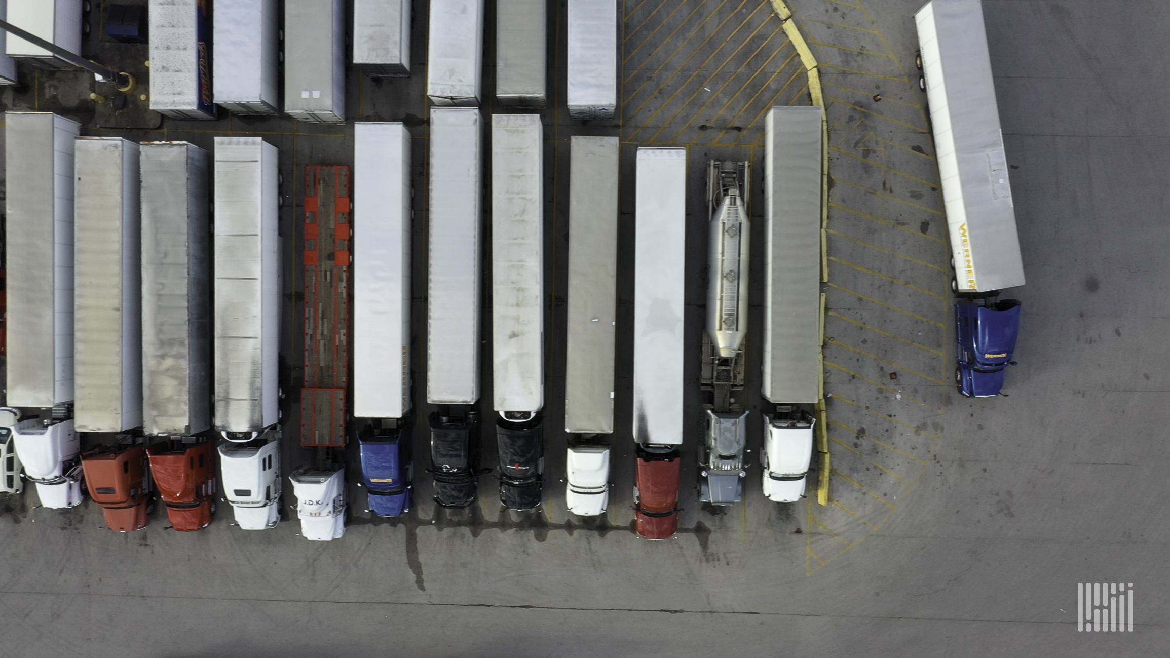 Aerial view of parked trucks.