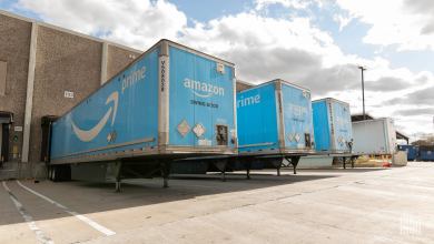 Amazon prime trailers outside a warehouse