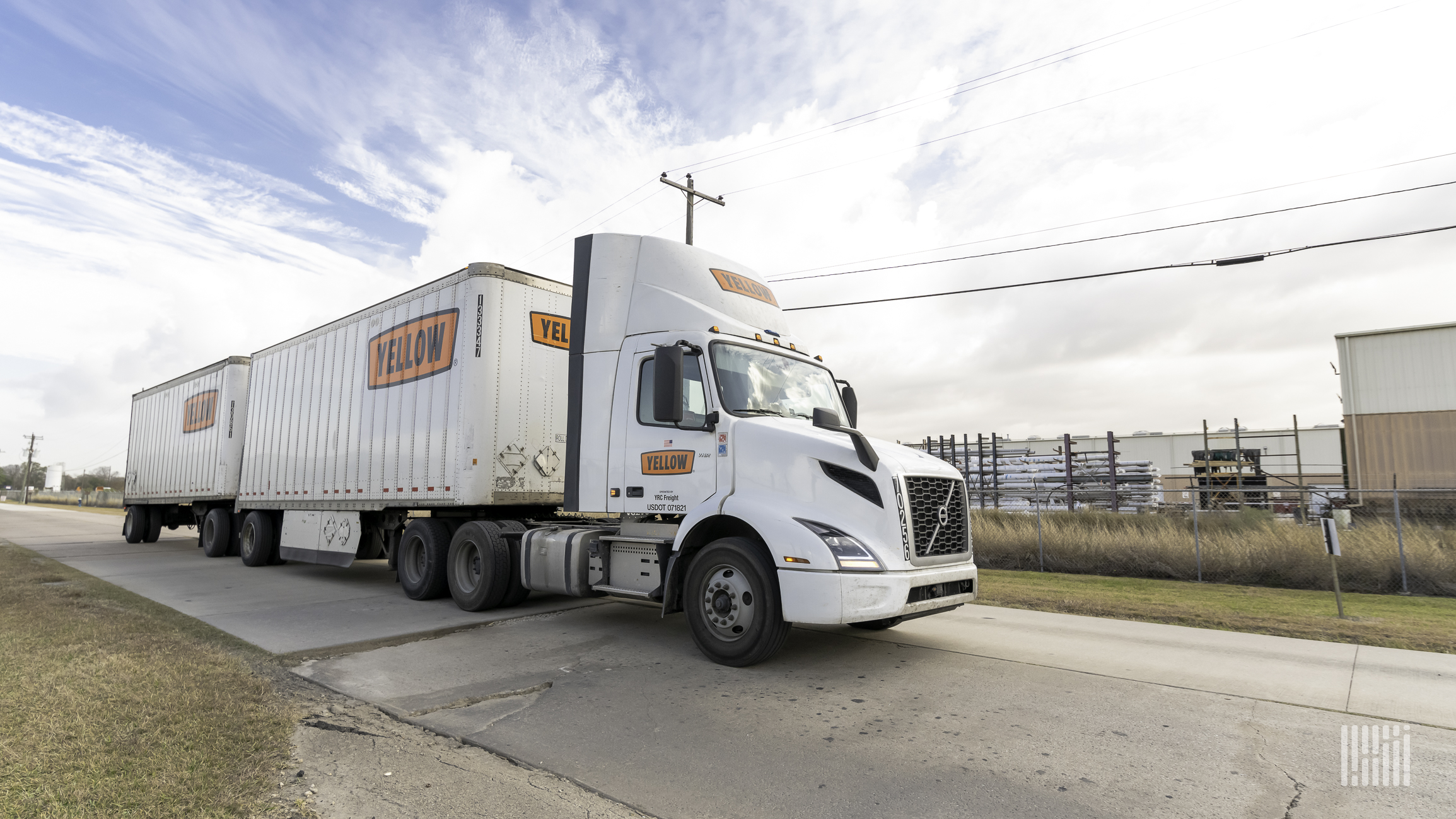 A tractor-trailer of LTL carrier Yellow Corp travels on a road.