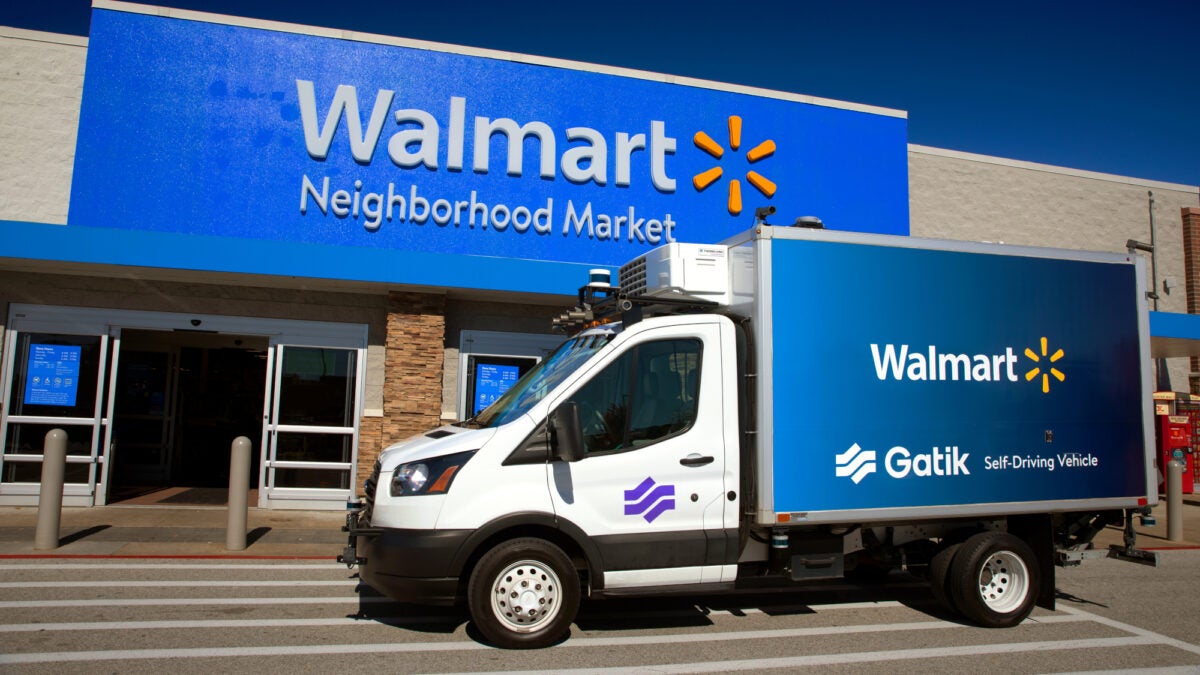 Gatik autonomous box truck parked in front of Walmart store.