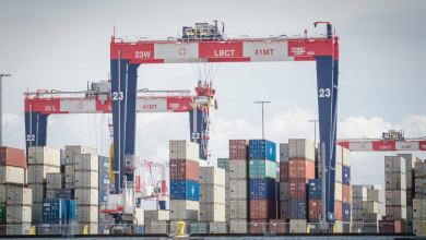 Cranes moving containers at Port of Long Beach