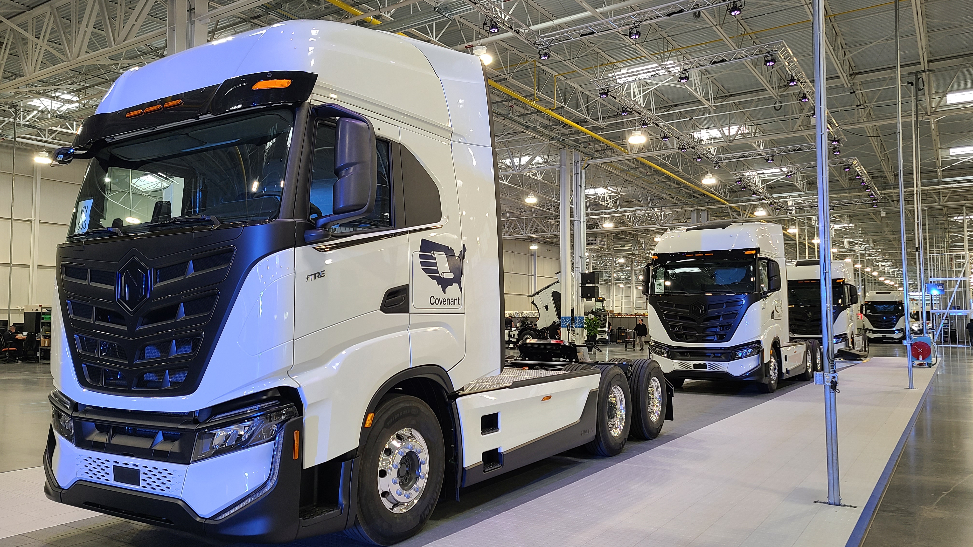 White Nikola Tre semi trucks on assembly line in Coolidge, Arizona