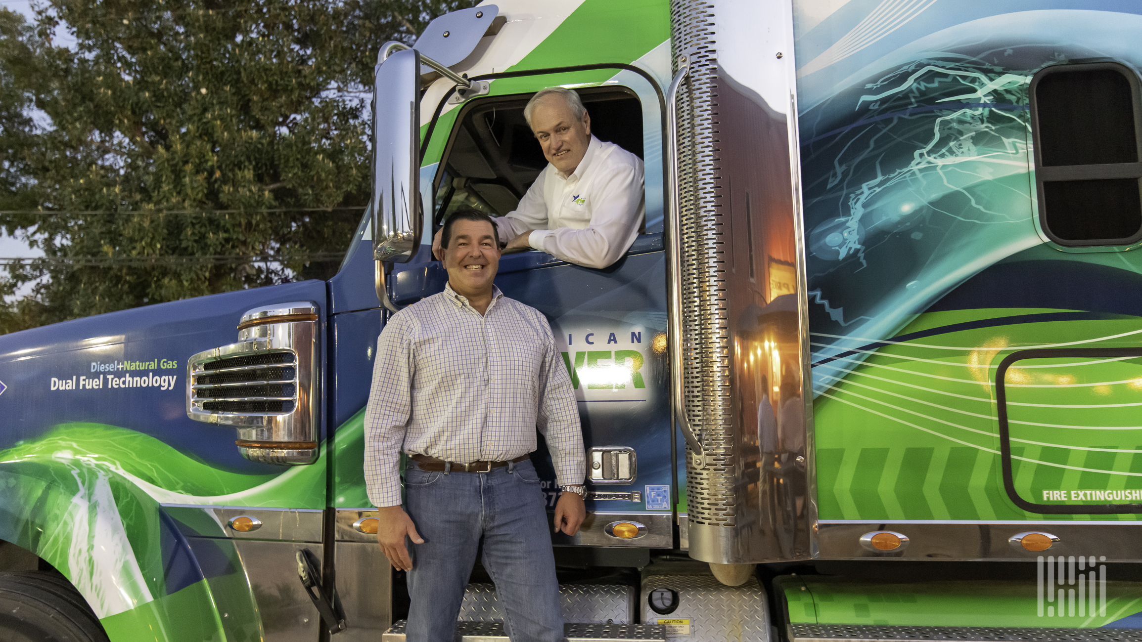 Chuck Coppa and Lyle Jensen with Freightliner Coronado retrofit to run and natural gas and diesel fuel
