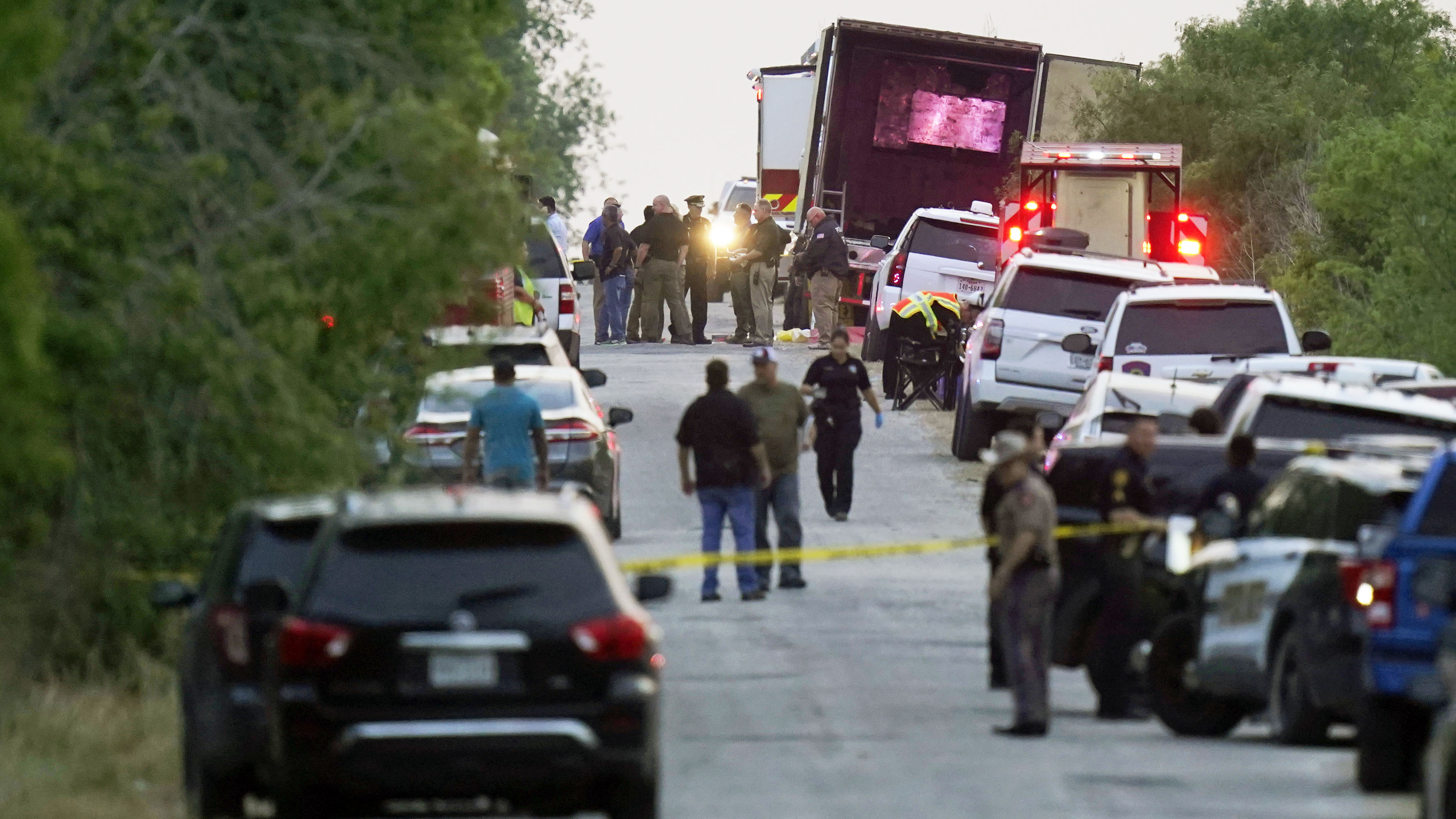 Police and other first responders work the scene dozens of people were been found dead in a trailer in San Antonio