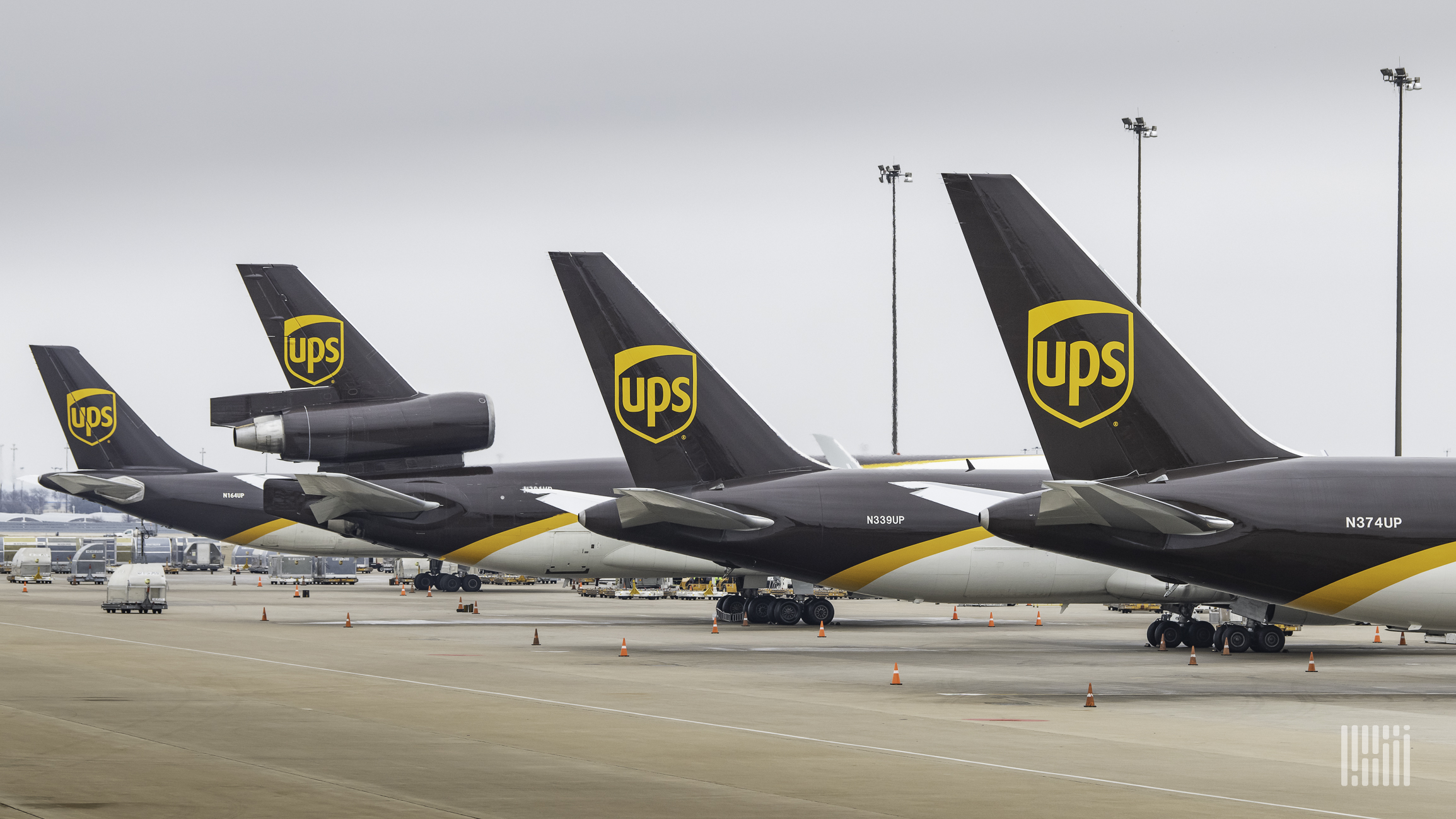 UPS "brown tails" lined up at an airport.