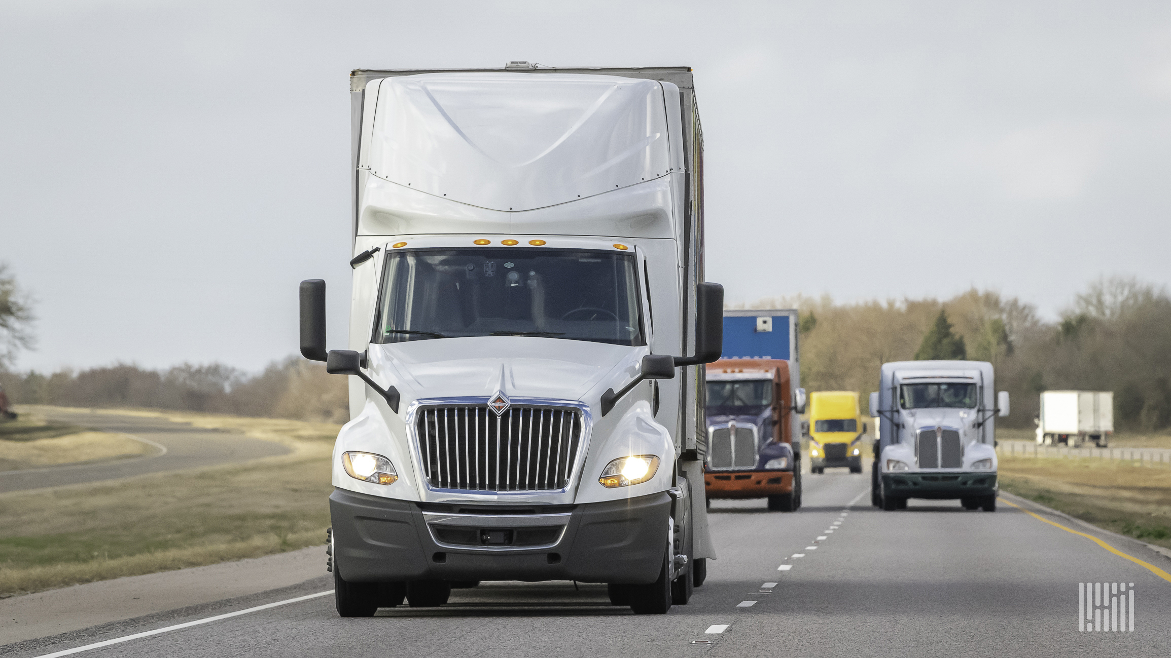 Several trucks on a highway