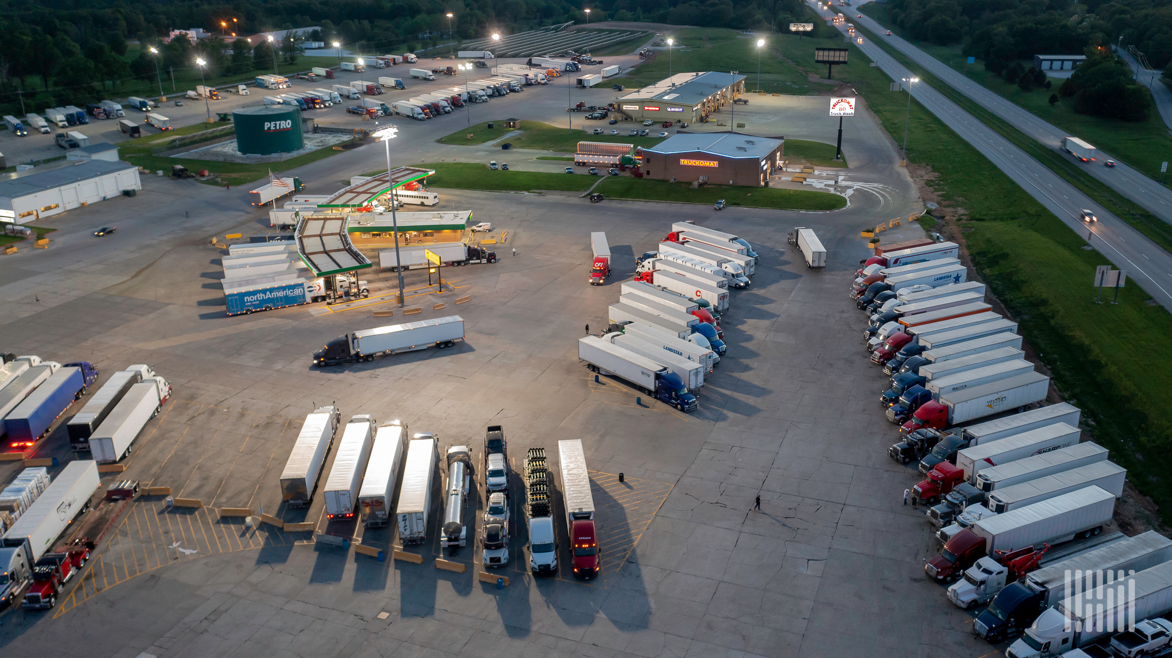 aerial view of trucks parked at a truck stop