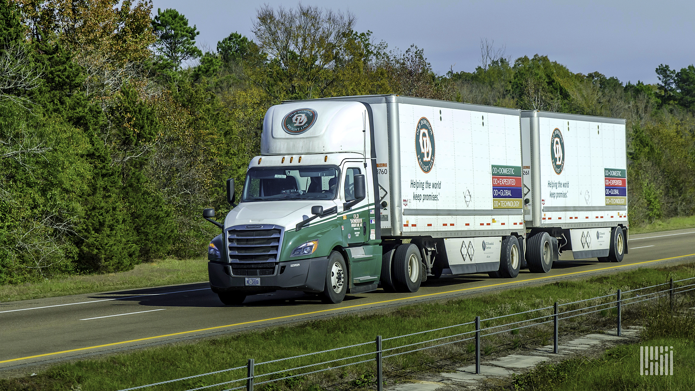 An Old Dominion truck pulling a double trailer.