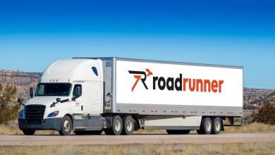A Roadrunner labeled trailer on the highway