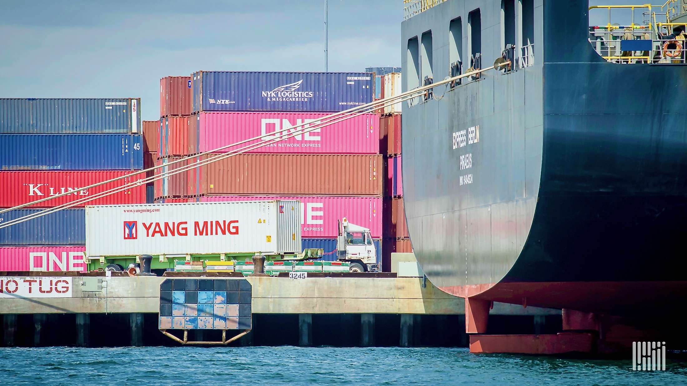 Shipping containers being unloaded from a ship at the Port of Long Beach.