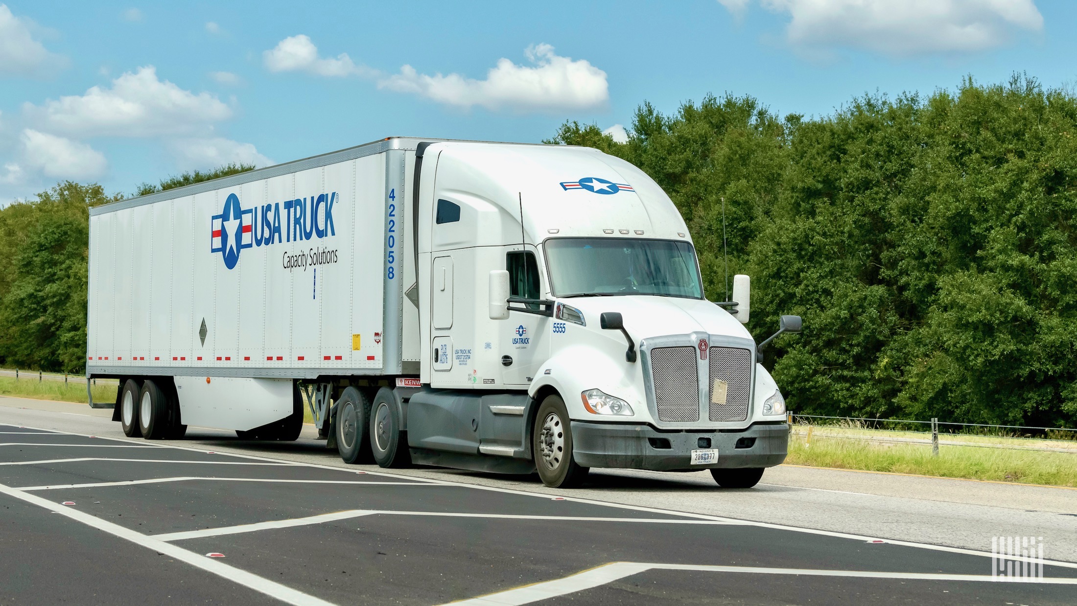 A white USA Truck tractor trailer