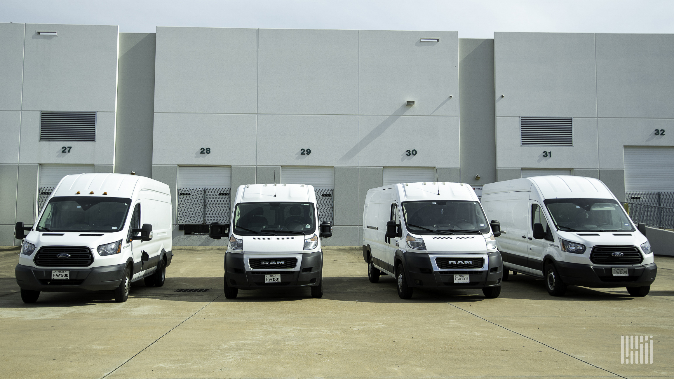 Vans parked at a warehouse