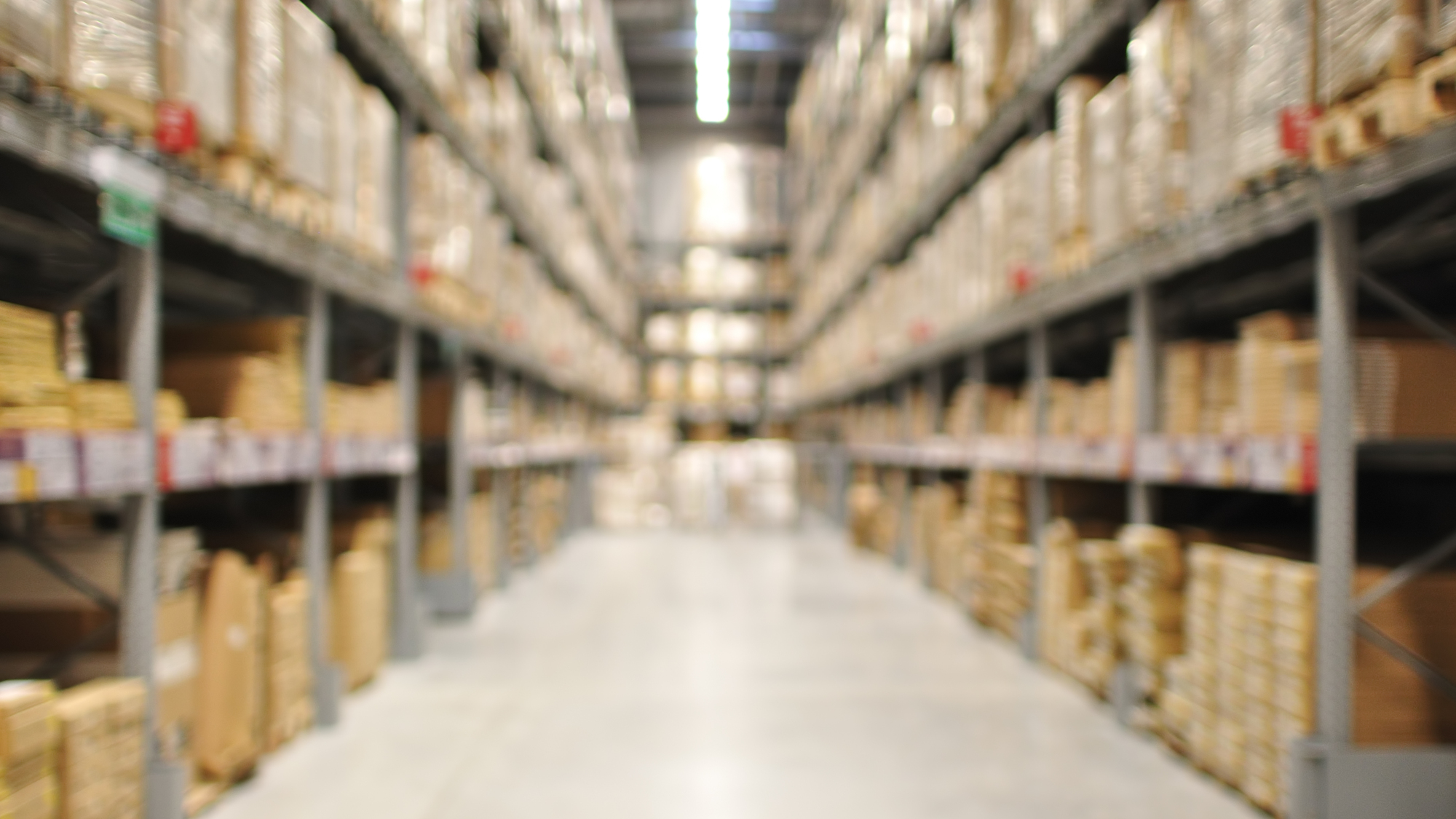 Defocused interior of warehouse aisle