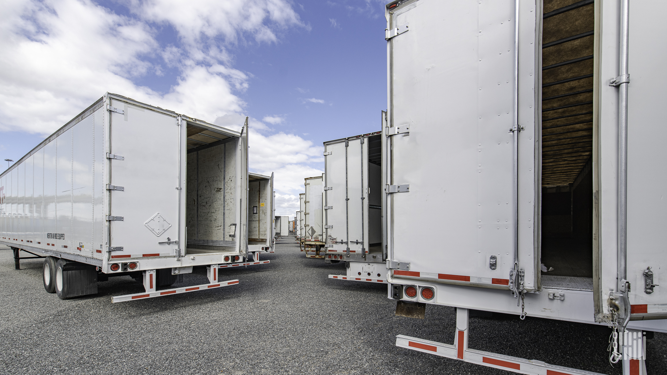 White trailers with doors open