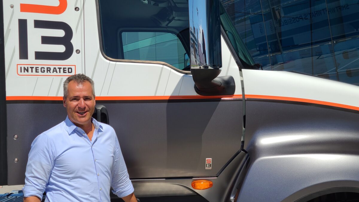 Navistar vice president Michael Grahe in front of company truck.