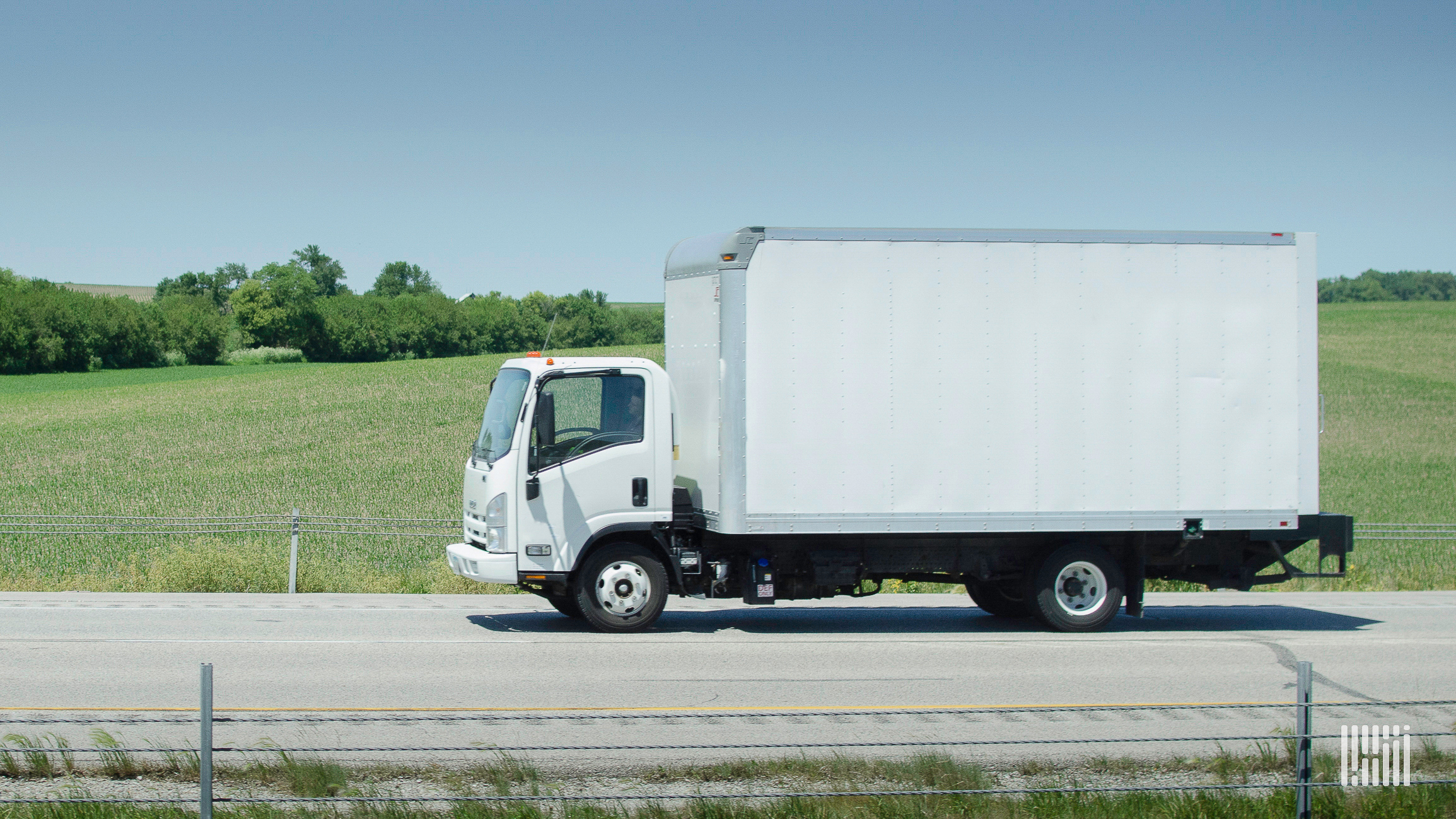 white box truck driving on highway