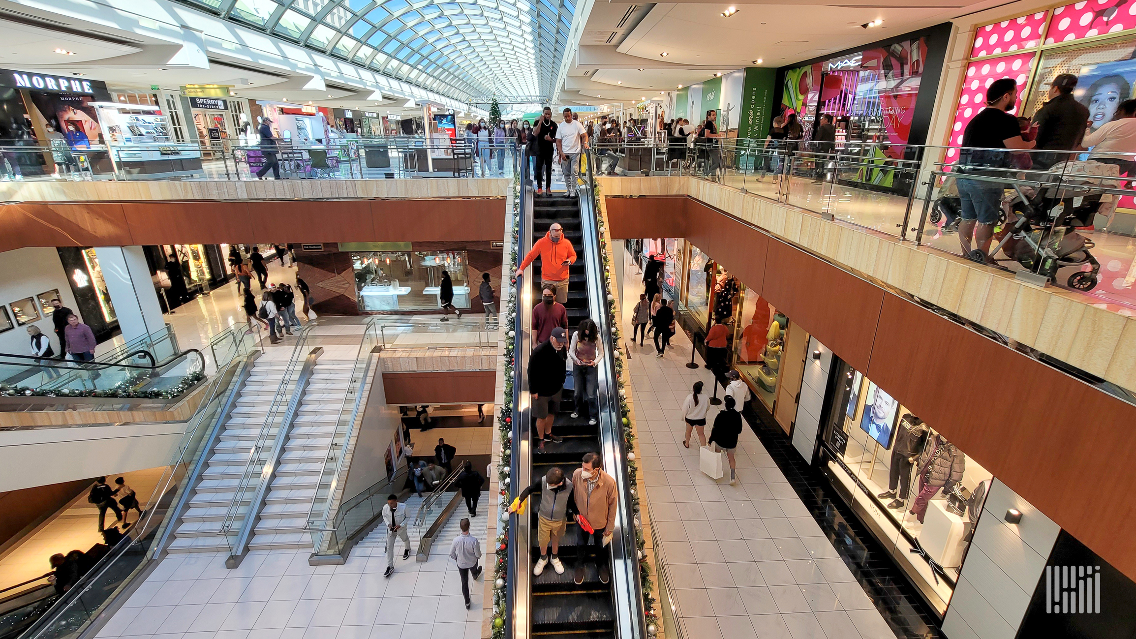 shoppers walk around a mall