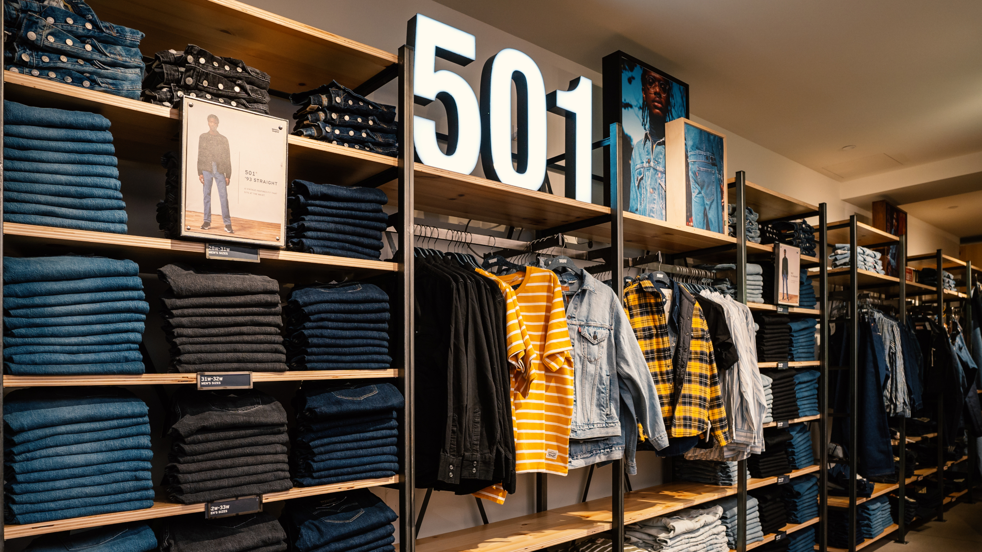 Jeans and other items on shelves inside Levi's store