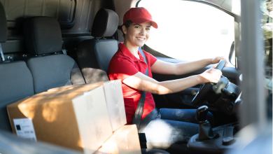Woman in delivery van with boxes