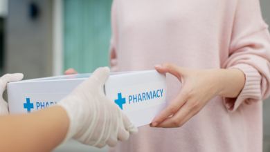 delivery driver hands over box of medicine