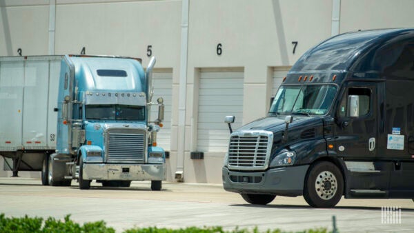 Trucks maneuver at a warehouse. (Photo: Jim Allen/FreightWaves)