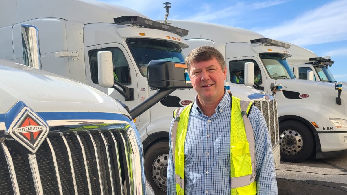 Jim Mullen with a TuSimple upfitted autonomous truck.