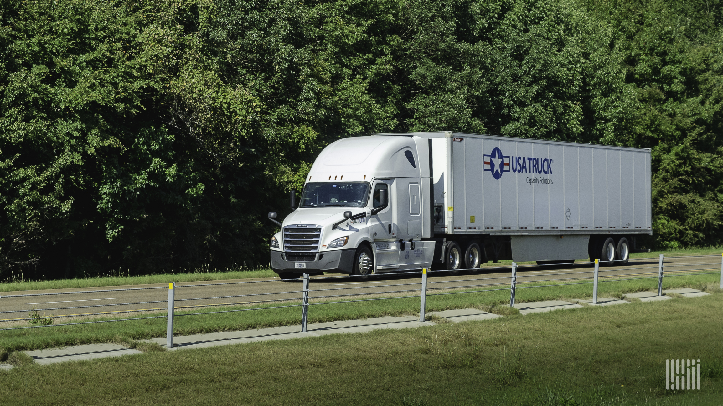 USA Truck tractor-trailer on highway