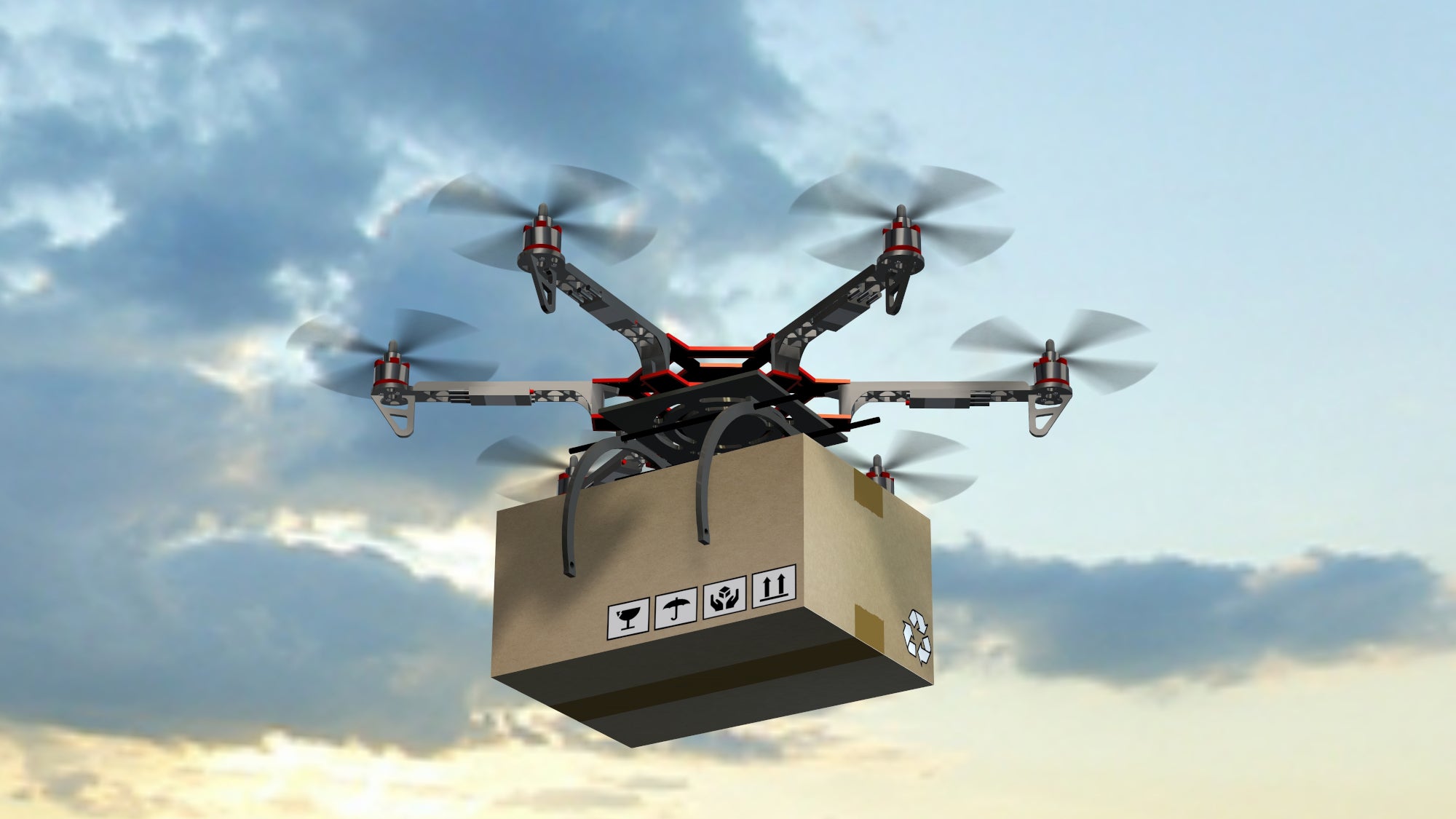 Drone carrying package through air