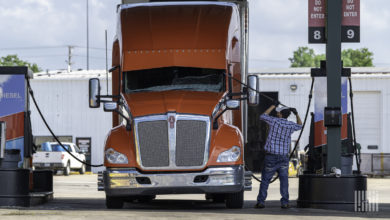 Driver with truck at service station