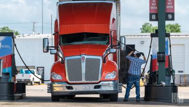 Driver with truck at service station