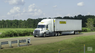 A white J.B. Hunt tractor-trailer on the highway