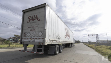 A Saia tractor-trailer approaching a railroad crossing