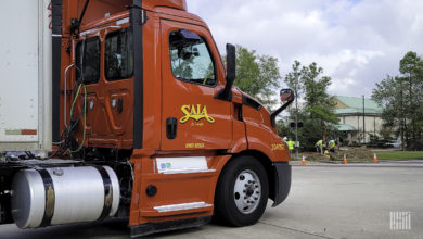 A red Saia truck in a parking lot