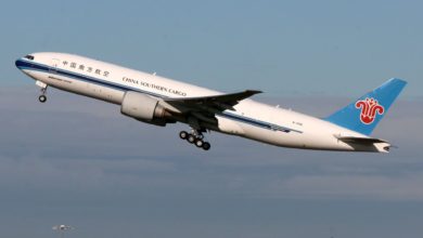 A white-and-blue China Southern Cargo plane takes off.