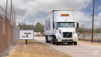 Yellow truck leaving a Houston teminal.