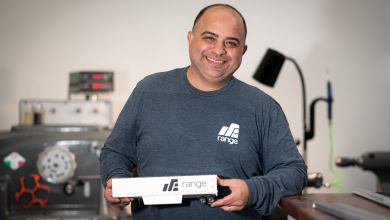 Avi Javidan holds miniature trailer.
