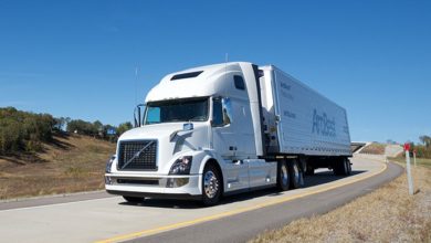 A white ArcBest tractor-trailer