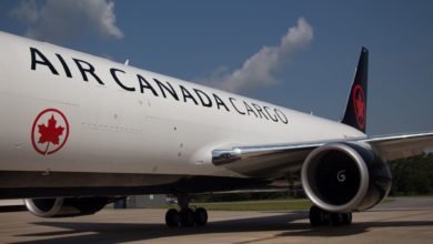 Close up from side of Air Canada Cargo fuselage, with black lettering and tail.