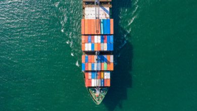 a photo of a container ship; imports keep falling