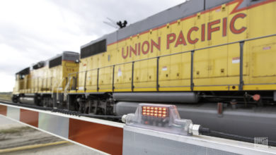 A Union Pacific train passes by a railroad crossing.