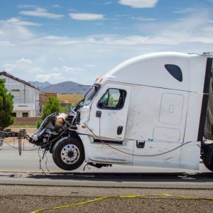 Prosecutors say a hit man killed a federal witness tied to staged 18-wheeler crashes