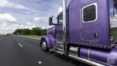 Purple truck on the highway