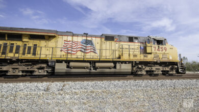 A Union Pacific locomotive travels down railroad track.