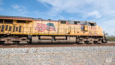 A Union Pacific locomotive travels down railroad track.
