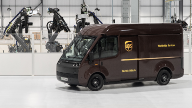 UPS mockup truck in front of robots