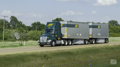 An ABF tractor pulling two LTL trailers