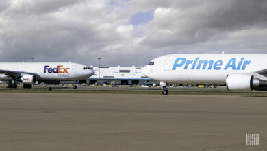 FedEx and Prime Air jets passing in opposite directions on taxiways.