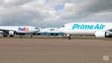 FedEx and Prime Air jets passing in opposite directions on taxiways.