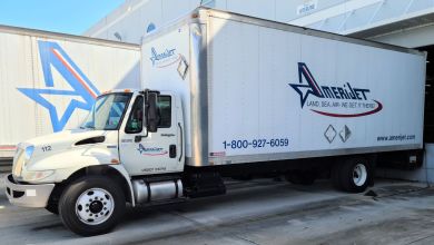 A white box van with blue Amerijet lettering at a loading dock.